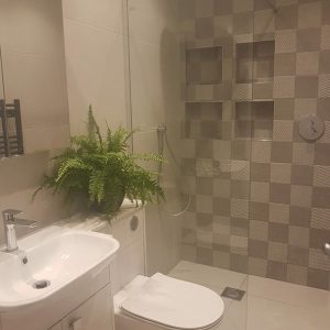 Beige bathroom wall and floor tiles
