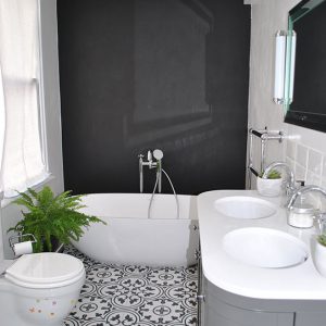 Black and white floor tiles in bathroom