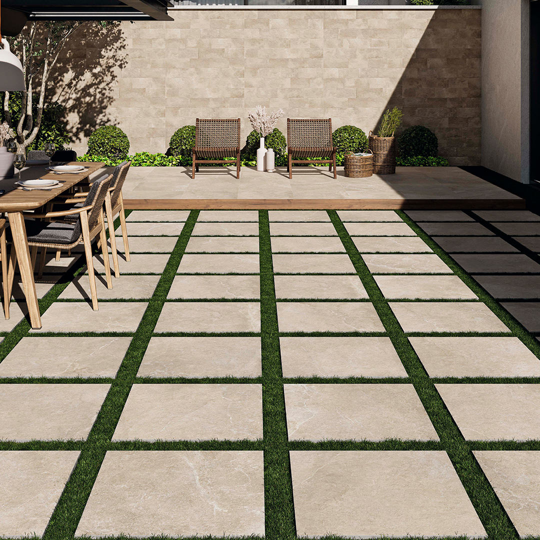 Outdoor patio with beige square tiles, a dining set to the left and a lounge set at the back.
