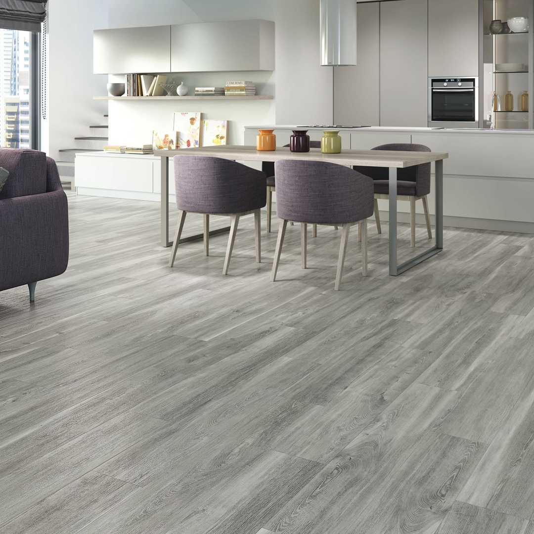 Grey wood-effect tiles in an open plan living and kitchen.